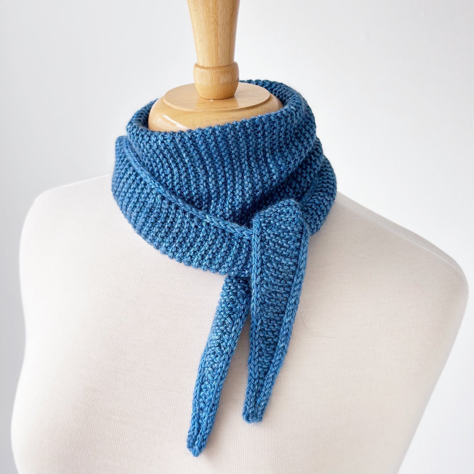 Sophie Scarf knitted in one hank of Loop Tendril merino silk DK yarn featuring garter stitch and elegant i-cord edges.