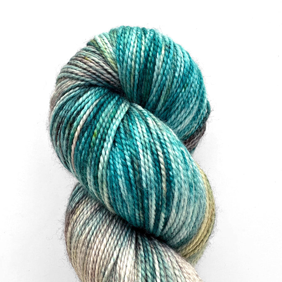 Emma’s Super Silky yarn in hand-dyed skeins, featuring vibrant colors and a silky sheen, ideal for elegant knitting projects.