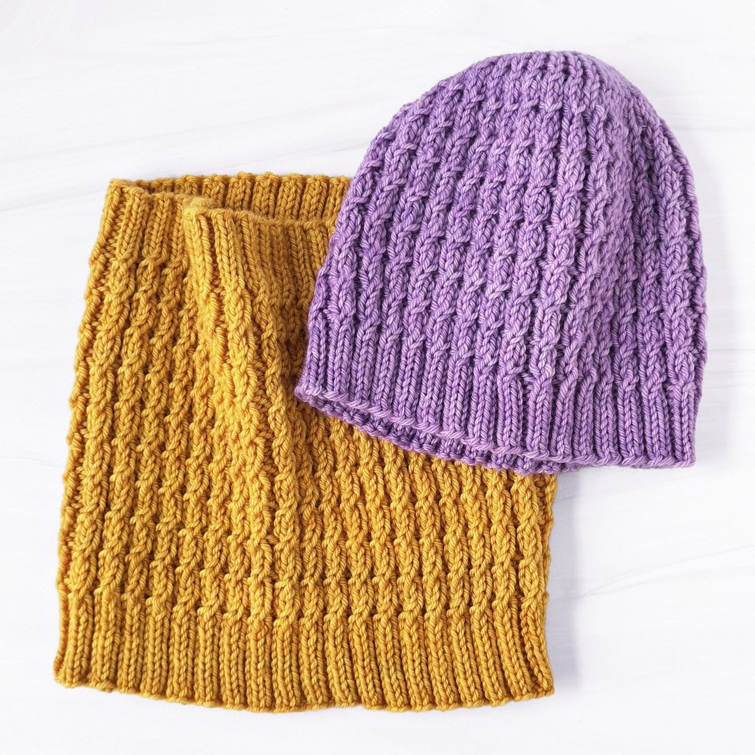 Baby cable knit hat and cowl set in purple and gold