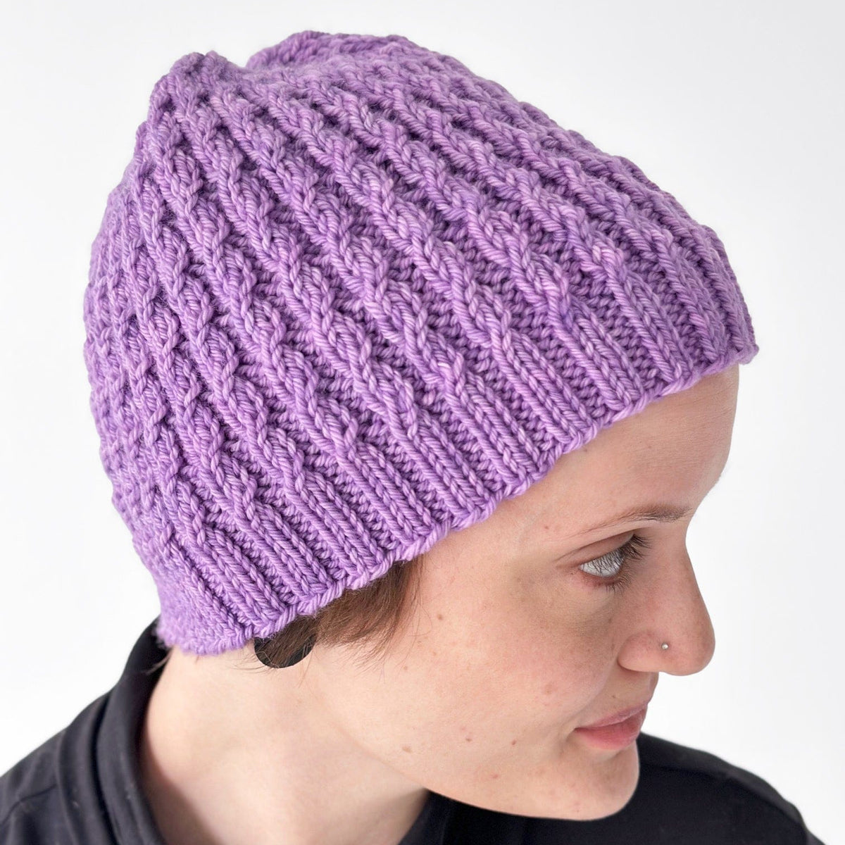 Purple cable knit baby hat