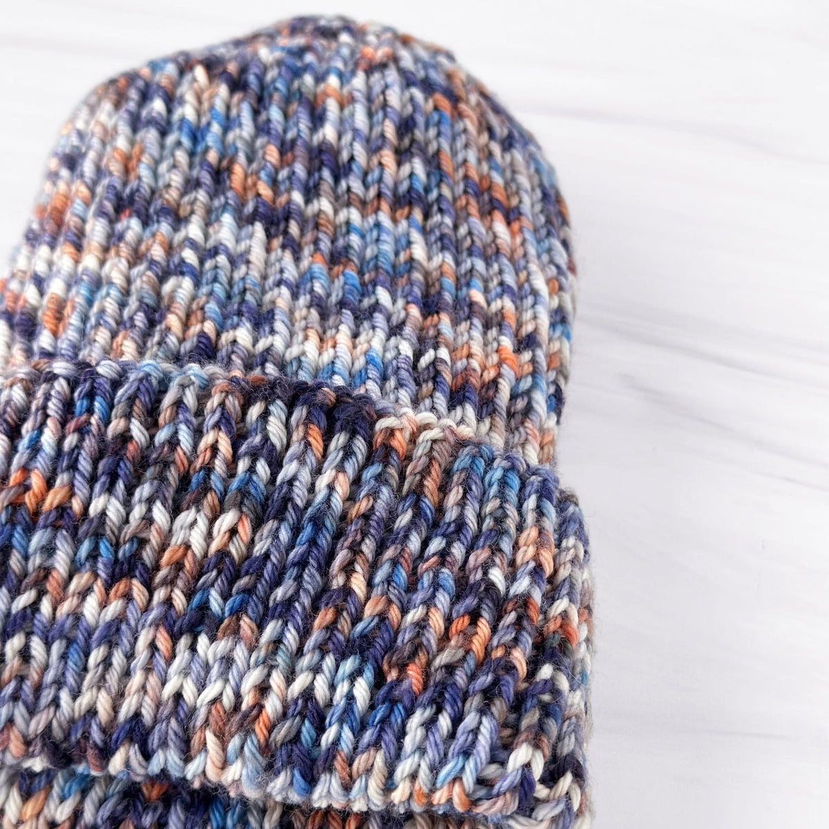 Rib knit hat in blue, orange, and white