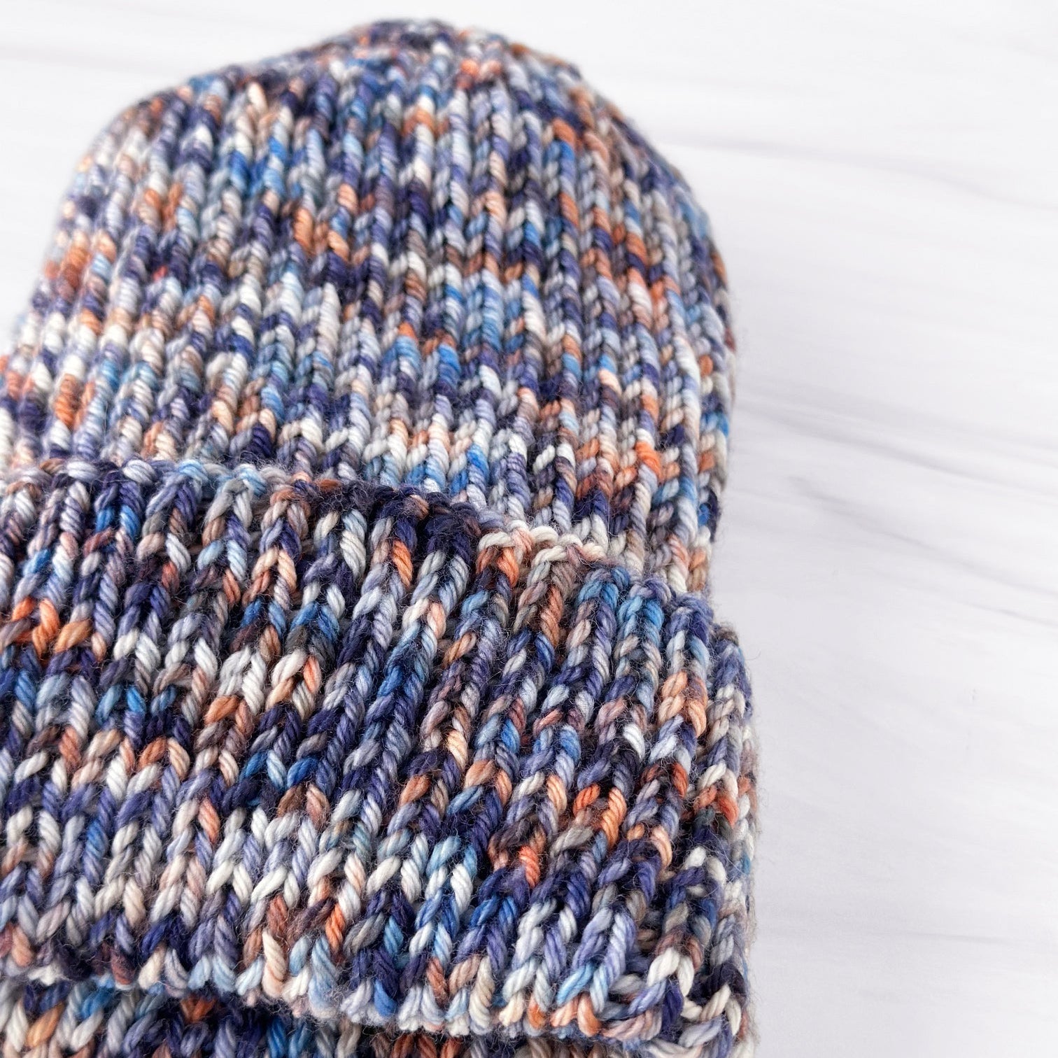 Rib knit hat in blue, orange, and white