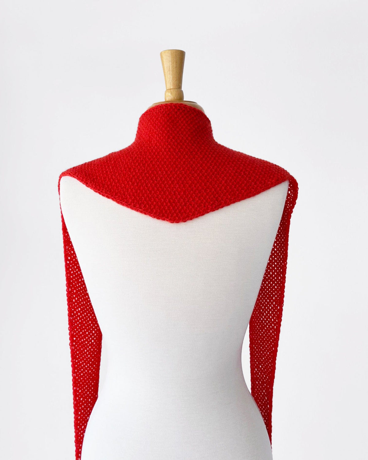 Red cashmere anniversary scarf on mannequin