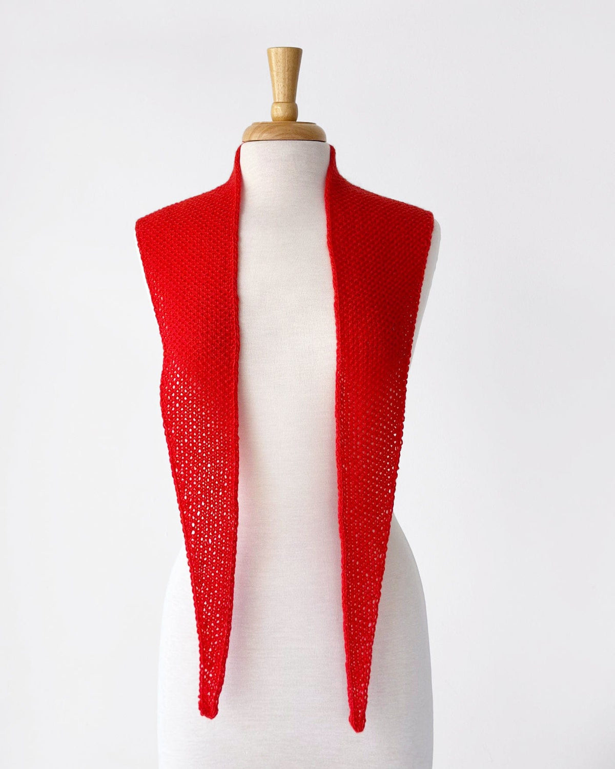 Red cashmere anniversary scarf on mannequin