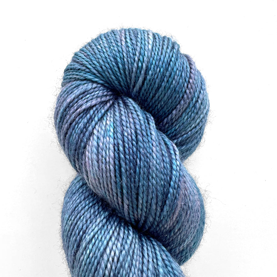 Emma’s Super Silky yarn in hand-dyed skeins, featuring vibrant colors and a silky sheen, ideal for elegant knitting projects.