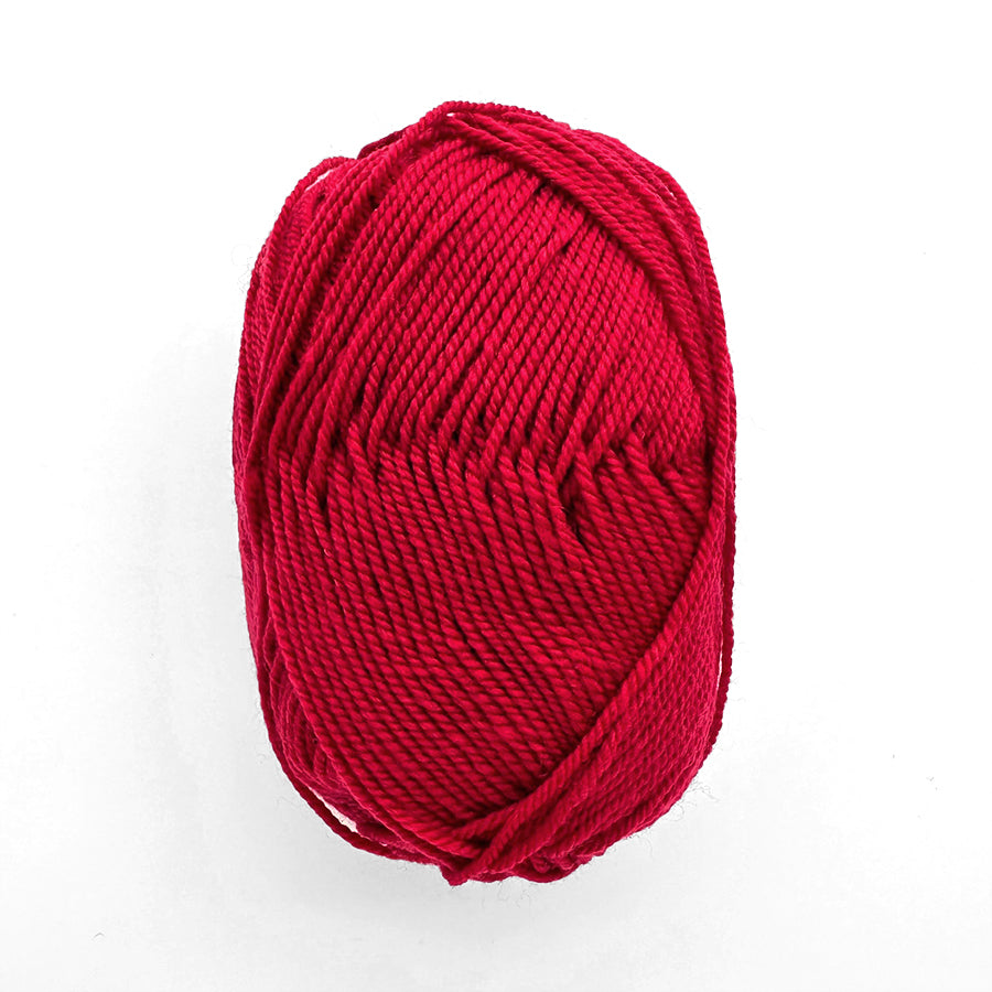 Red skein of yarn on a white background