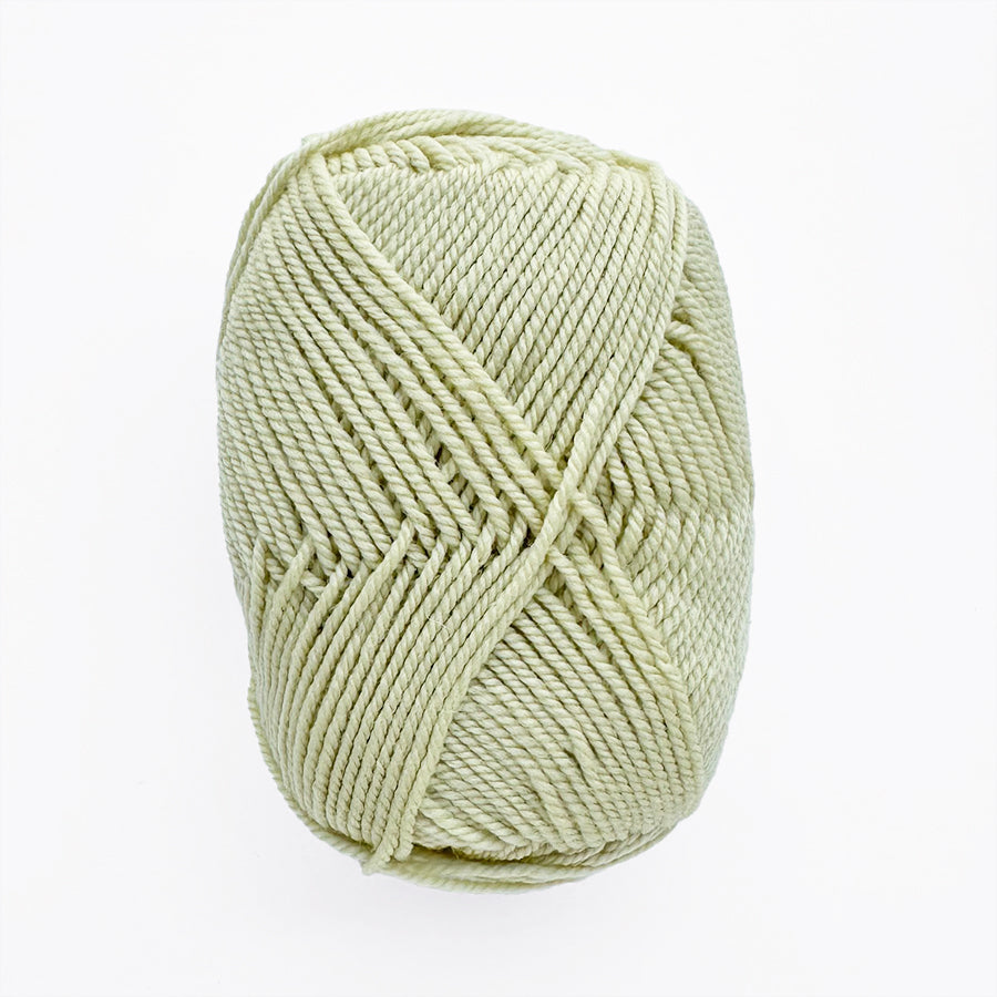 Light green skein of yarn on a white background