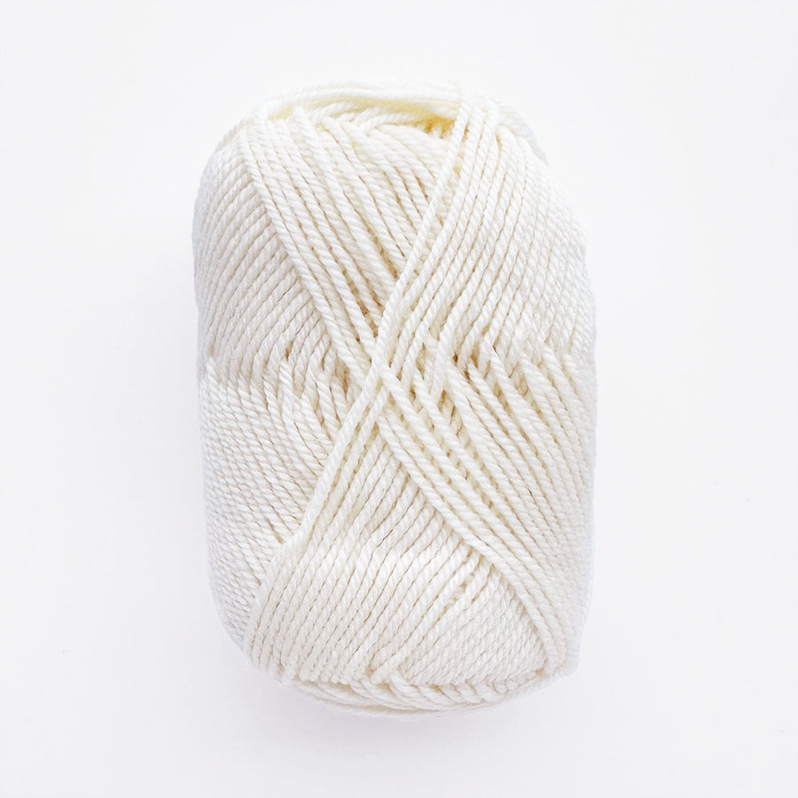 Ball of white yarn on a white background