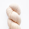 Apricot-colored yarn skein