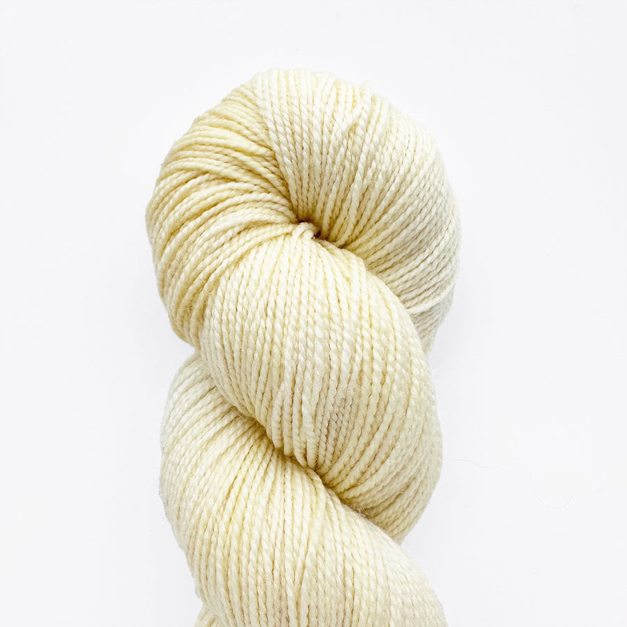 Lemon-colored yarn skein, loop-sprig