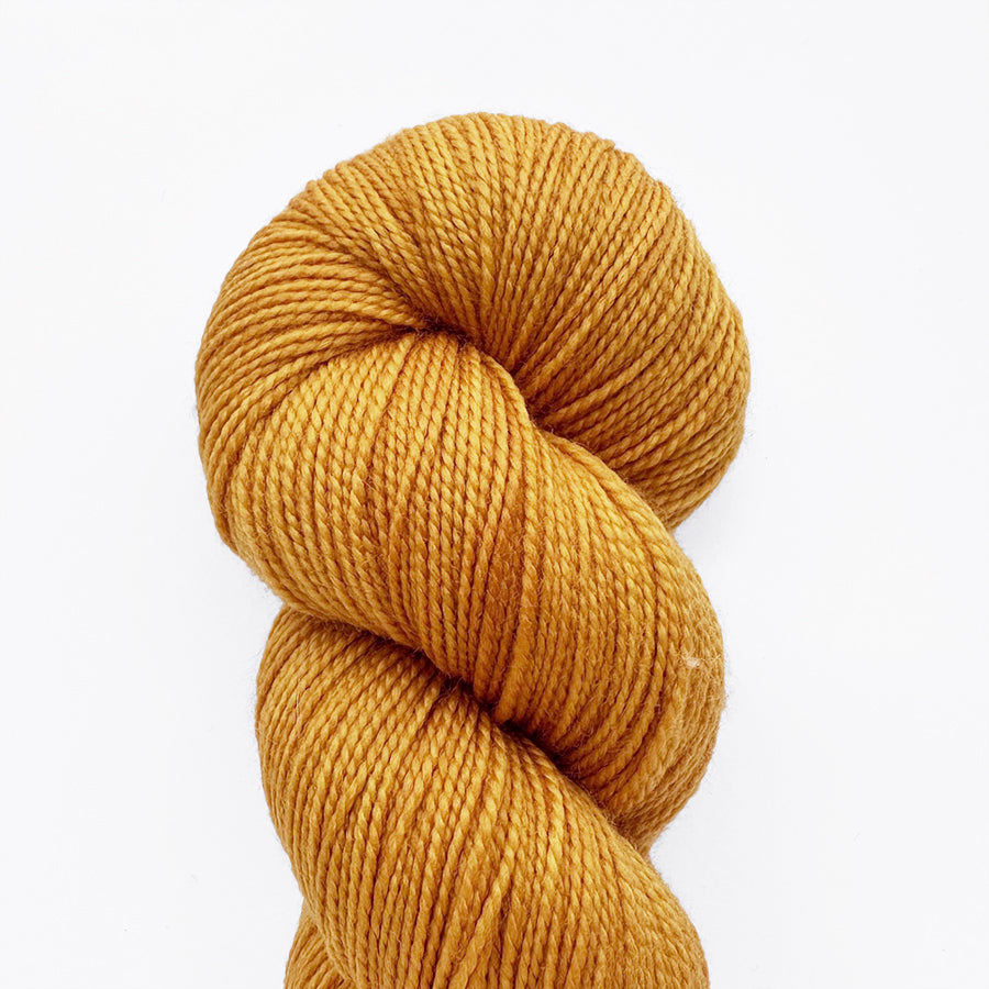 Marigold yarn skein in a loop