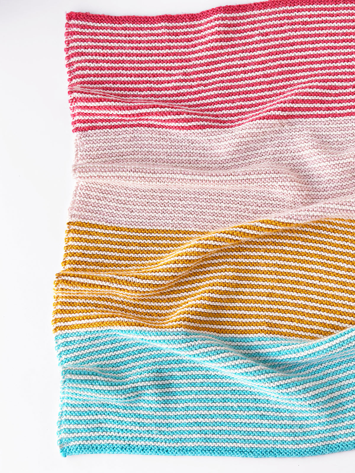 Seaside striped blanket in pink, gold, and blue