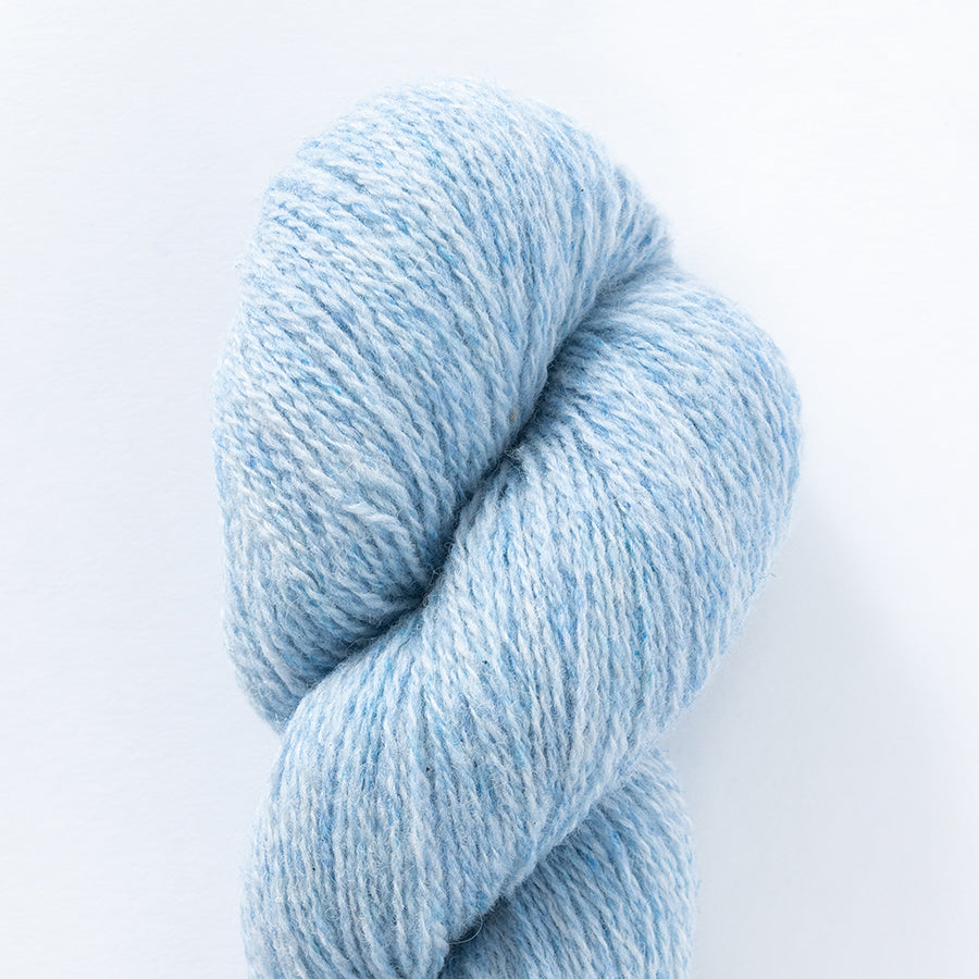 Le Petit Lambswool in very light blue.